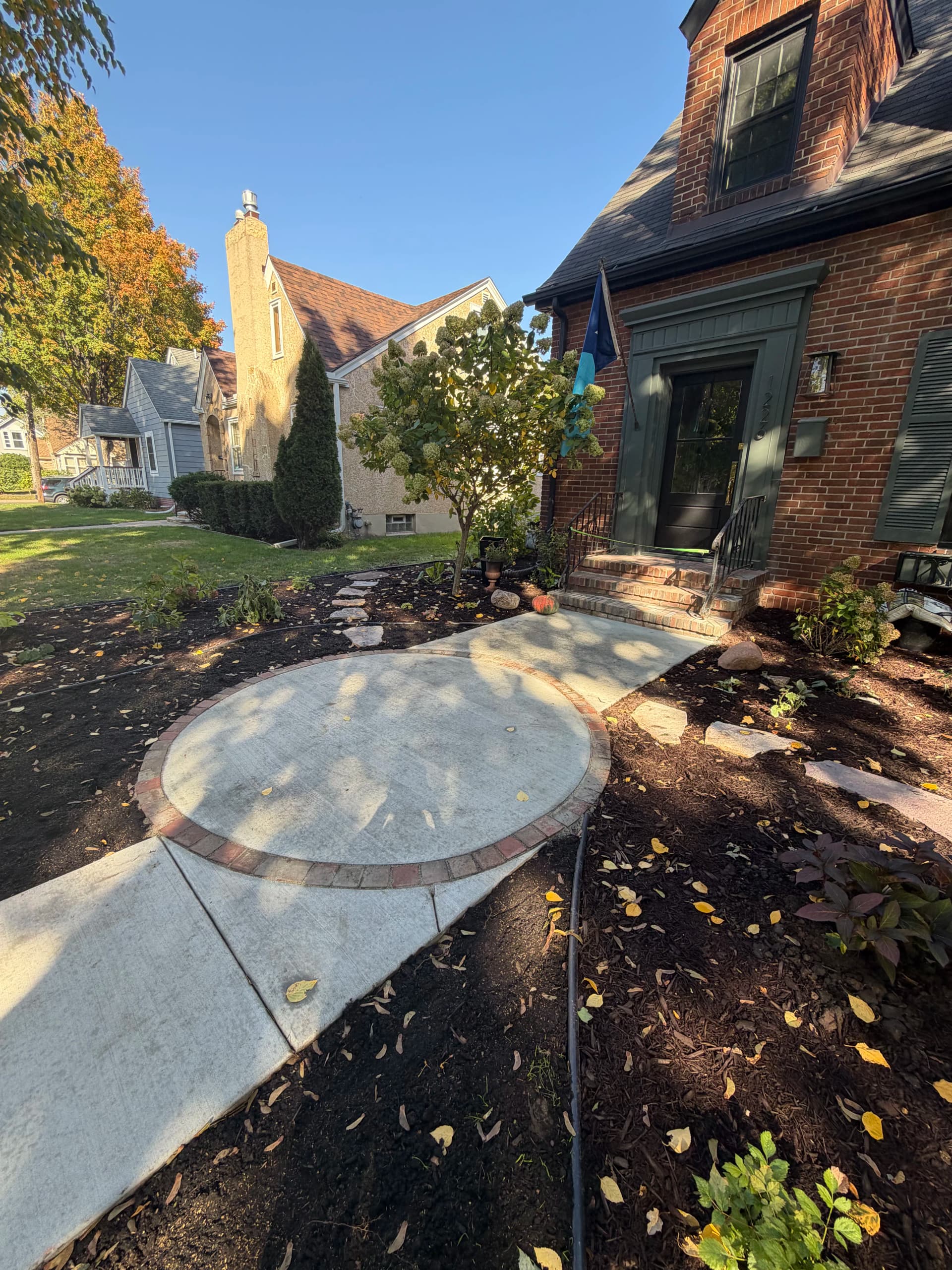 Gallery photos for Front Yard Landscape Design with Granite Patio and Brick Edging: Image #1