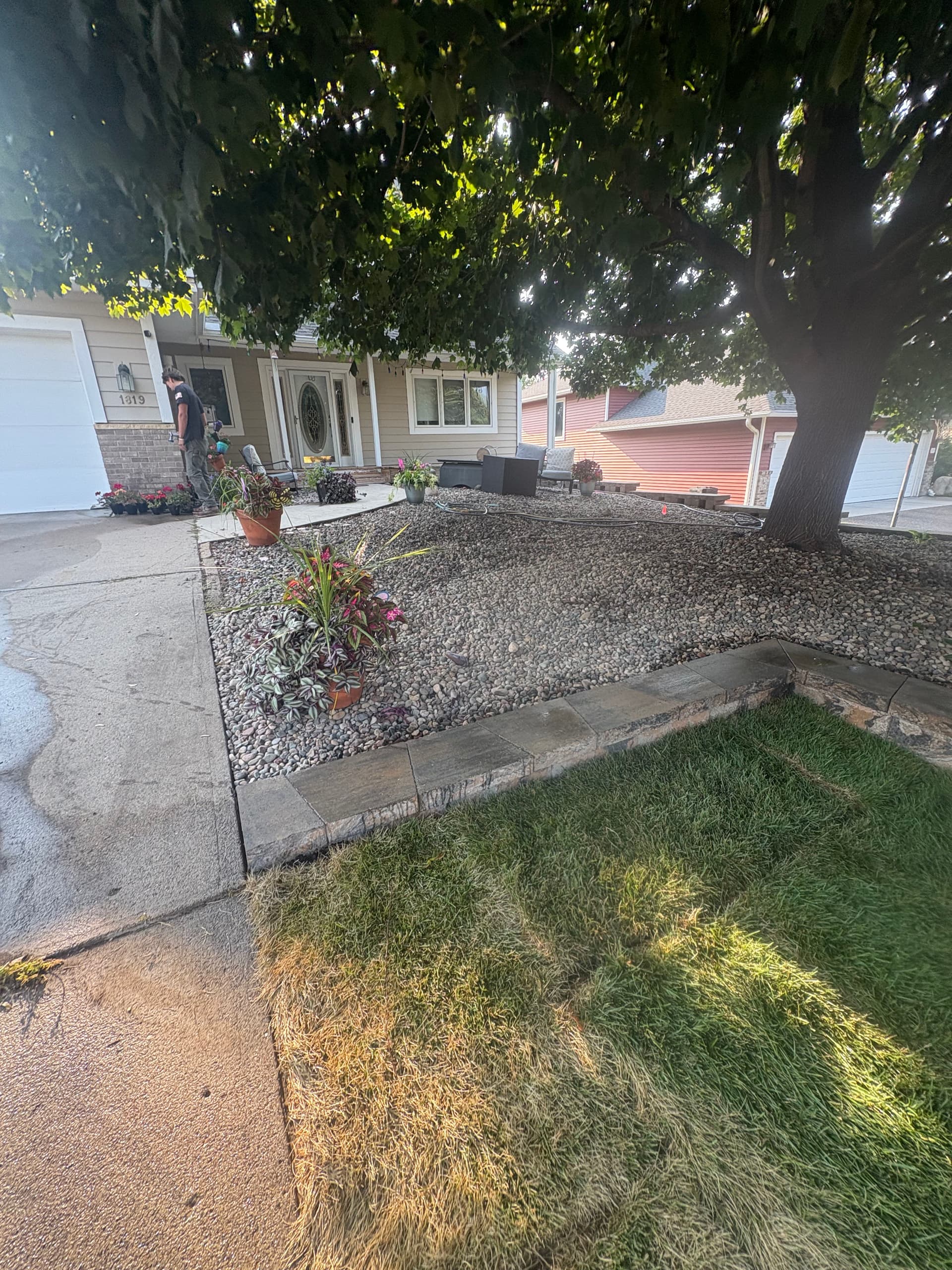 Gallery photos for Belgrade Front Yard Retaining Wall Sod and River Rock Install: Image #6