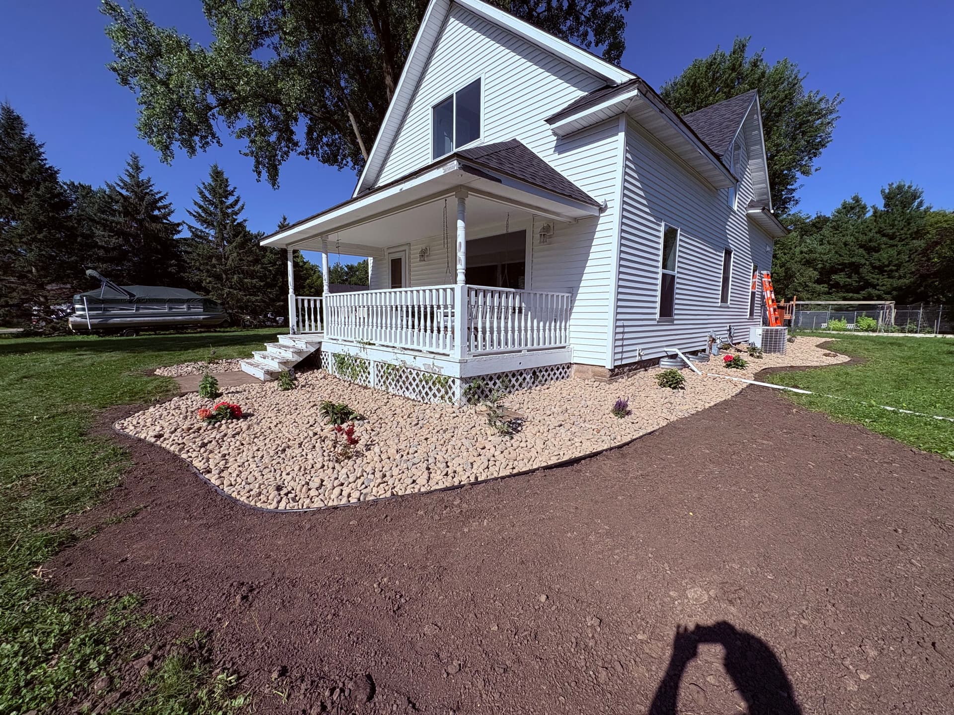 River Rock and Plant Installation That Actually Boosts Curb Appeal image