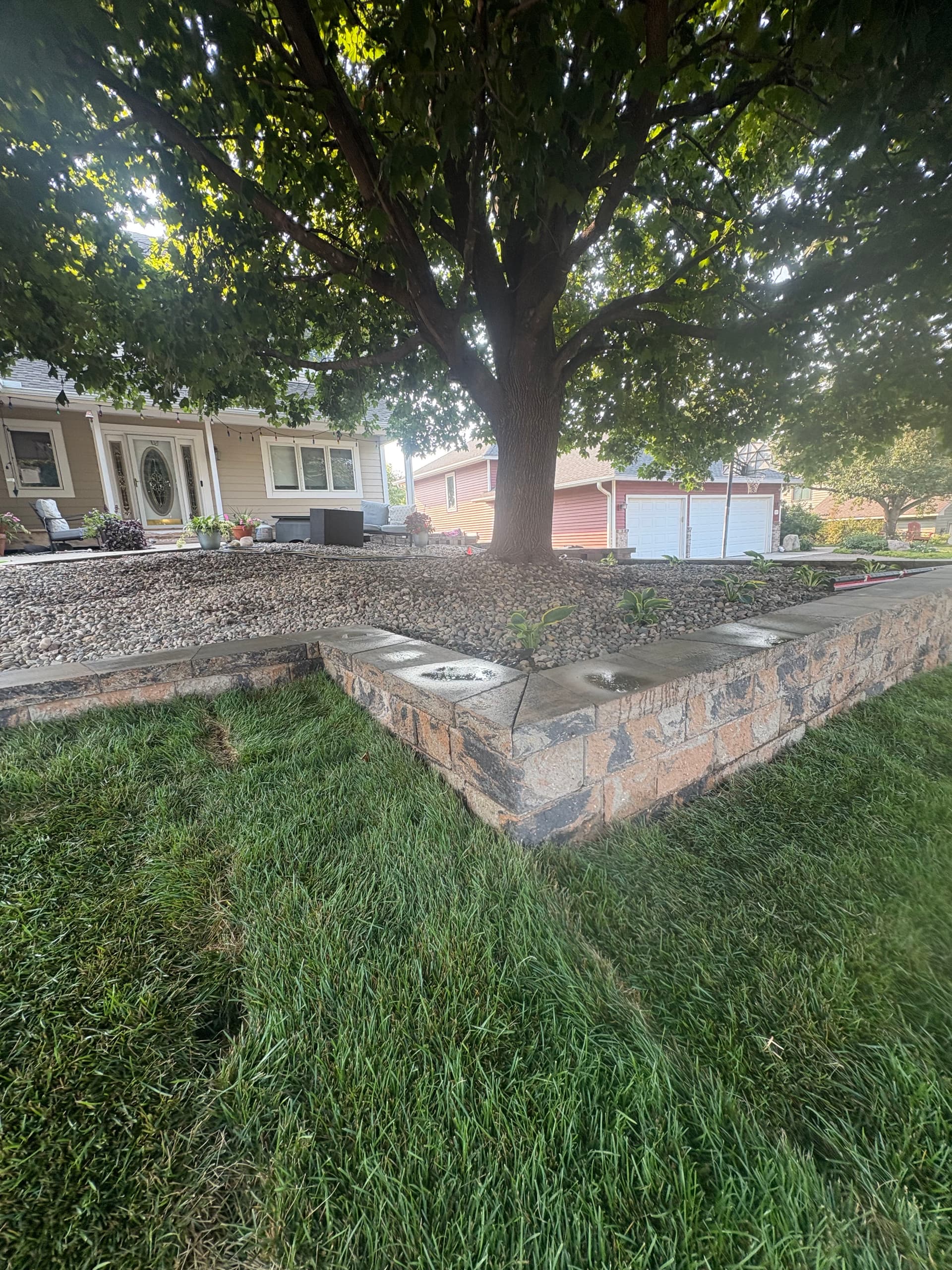 Gallery photos for Belgrade Front Yard Retaining Wall Sod and River Rock Install: Image #5