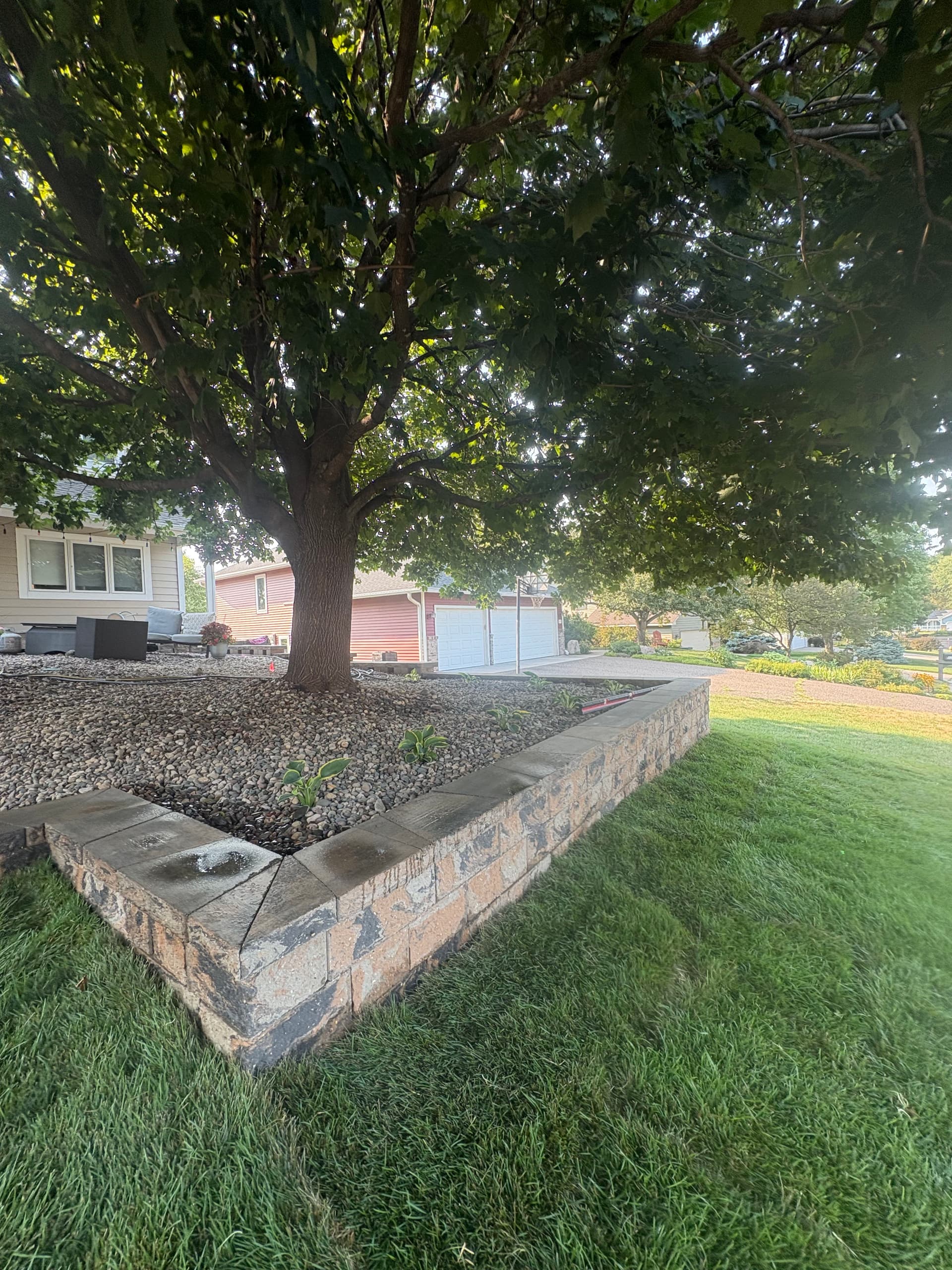 Gallery photos for Belgrade Front Yard Retaining Wall Sod and River Rock Install: Image #3