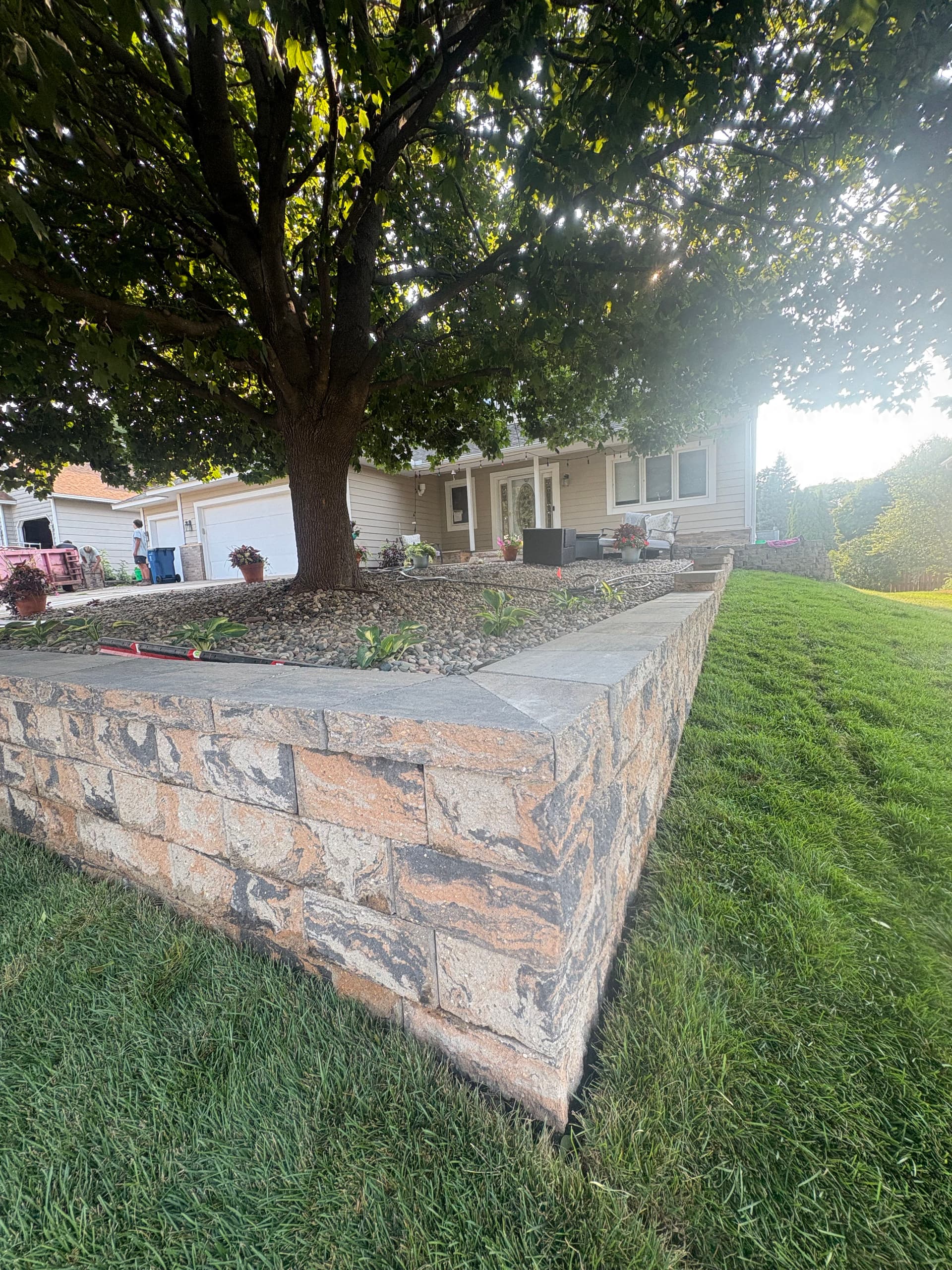 Gallery photos for Belgrade Front Yard Retaining Wall Sod and River Rock Install: Image #2