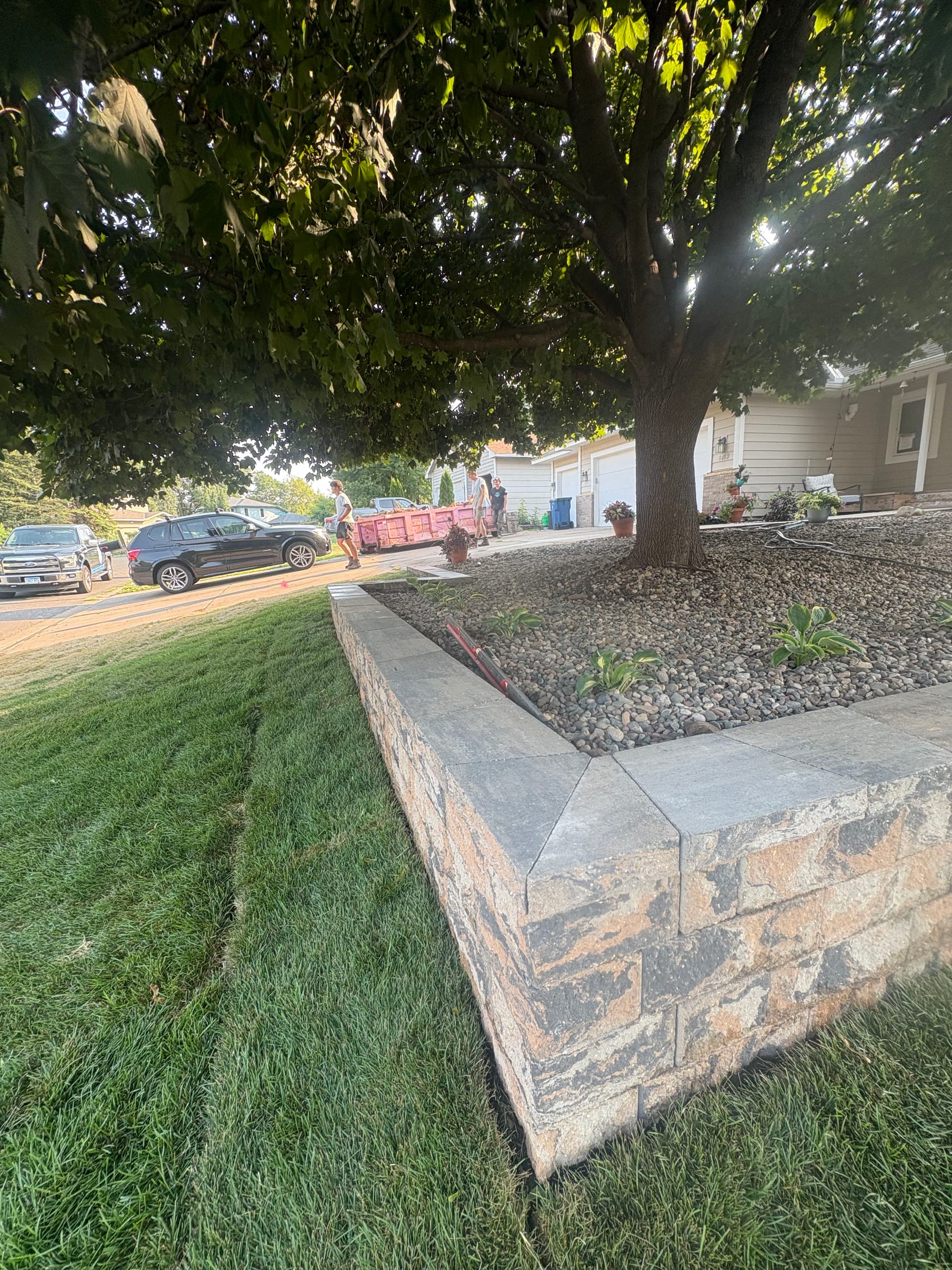 Gallery photos for Belgrade Front Yard Retaining Wall Sod and River Rock Install: Image #1