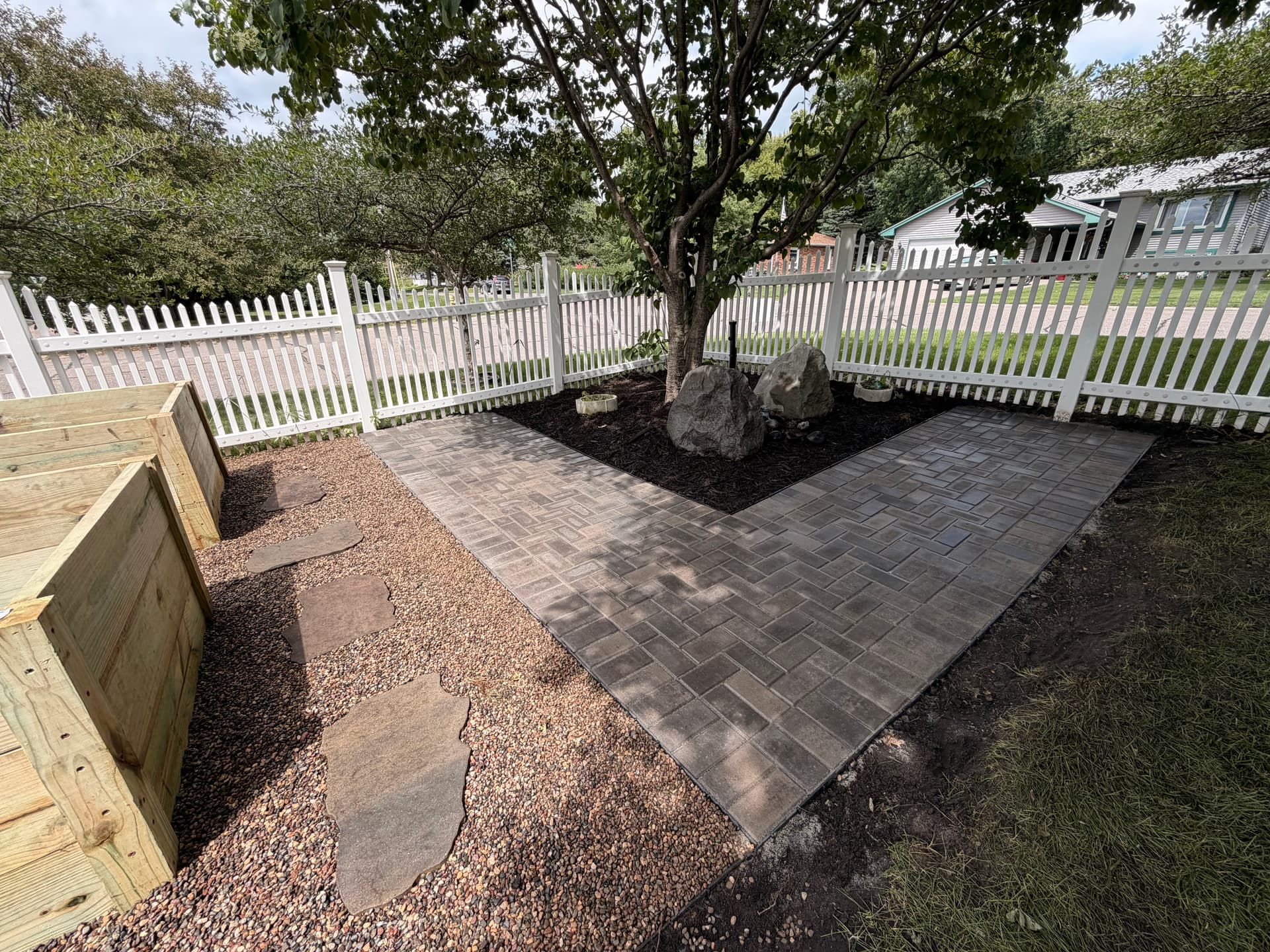 Paver Walkway and Custom Planter Boxes Turn a Backyard Into a Garden Space