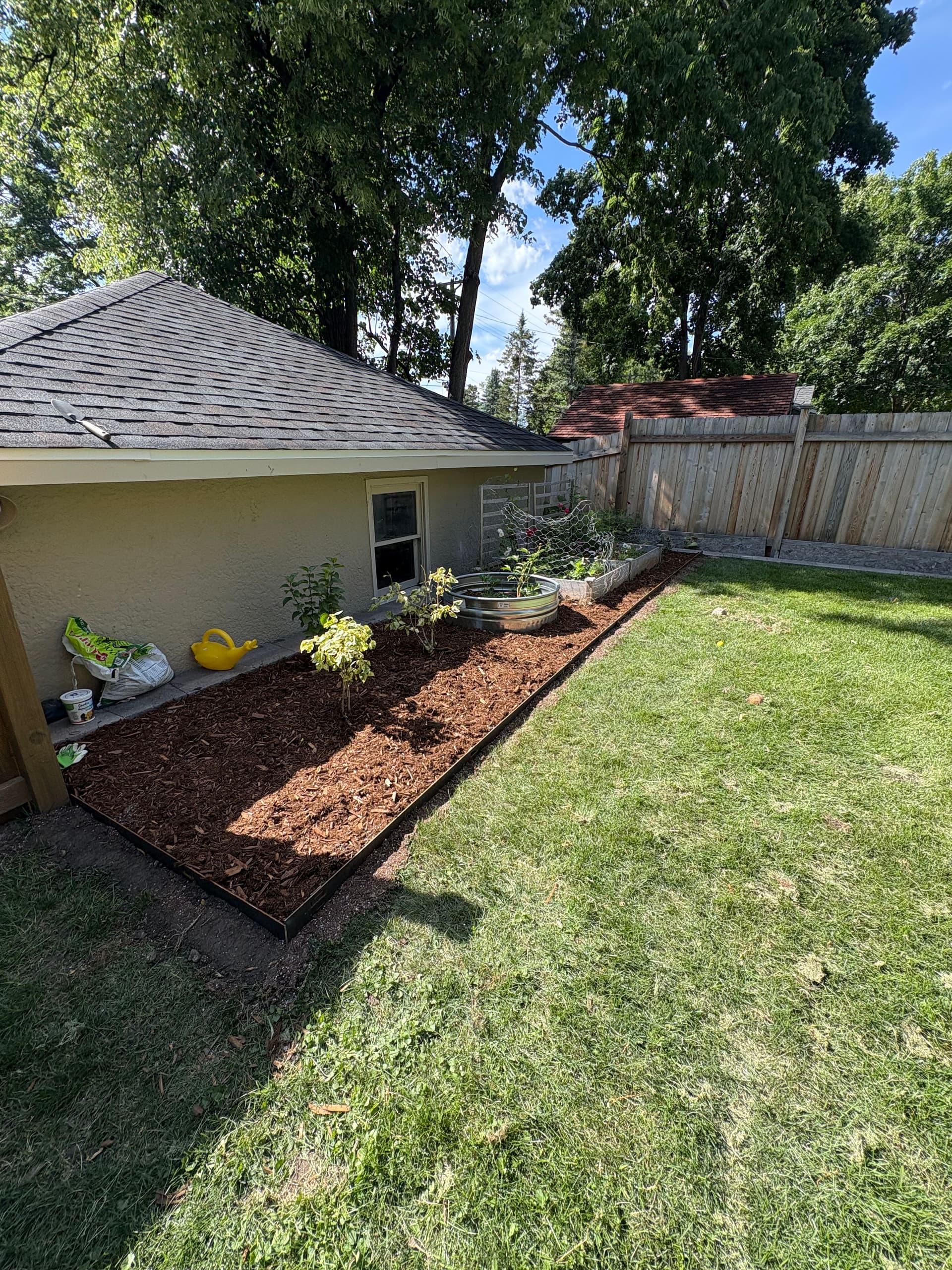 Gallery photos for Cedar Mulch, River Rock, and Fresh Plantings in Minneapolis: Image #4