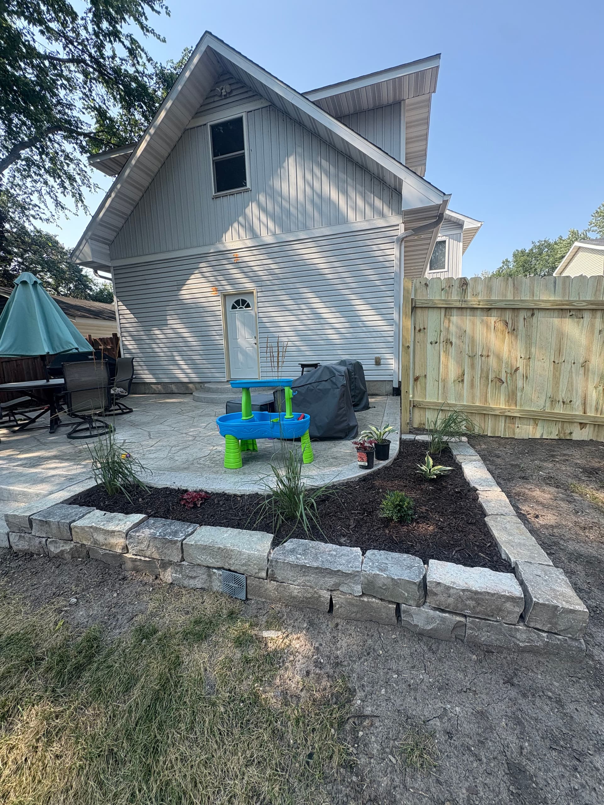 Gallery photos for Stamped Concrete Patio and Chilton Retaining Wall Backyard Build: Image #1