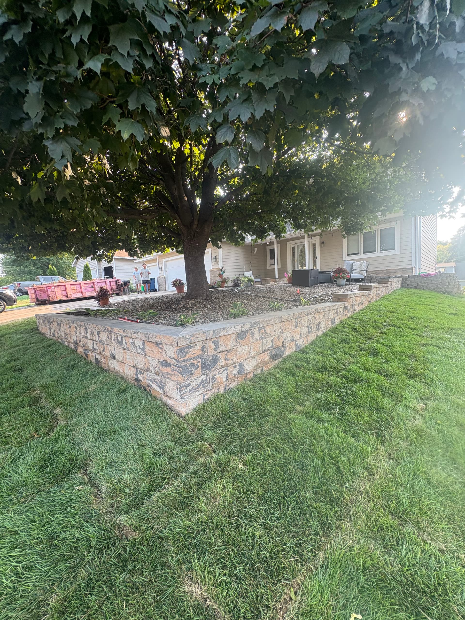 Gallery photos for Belgrade Front Yard Retaining Wall Sod and River Rock Install: Image #4