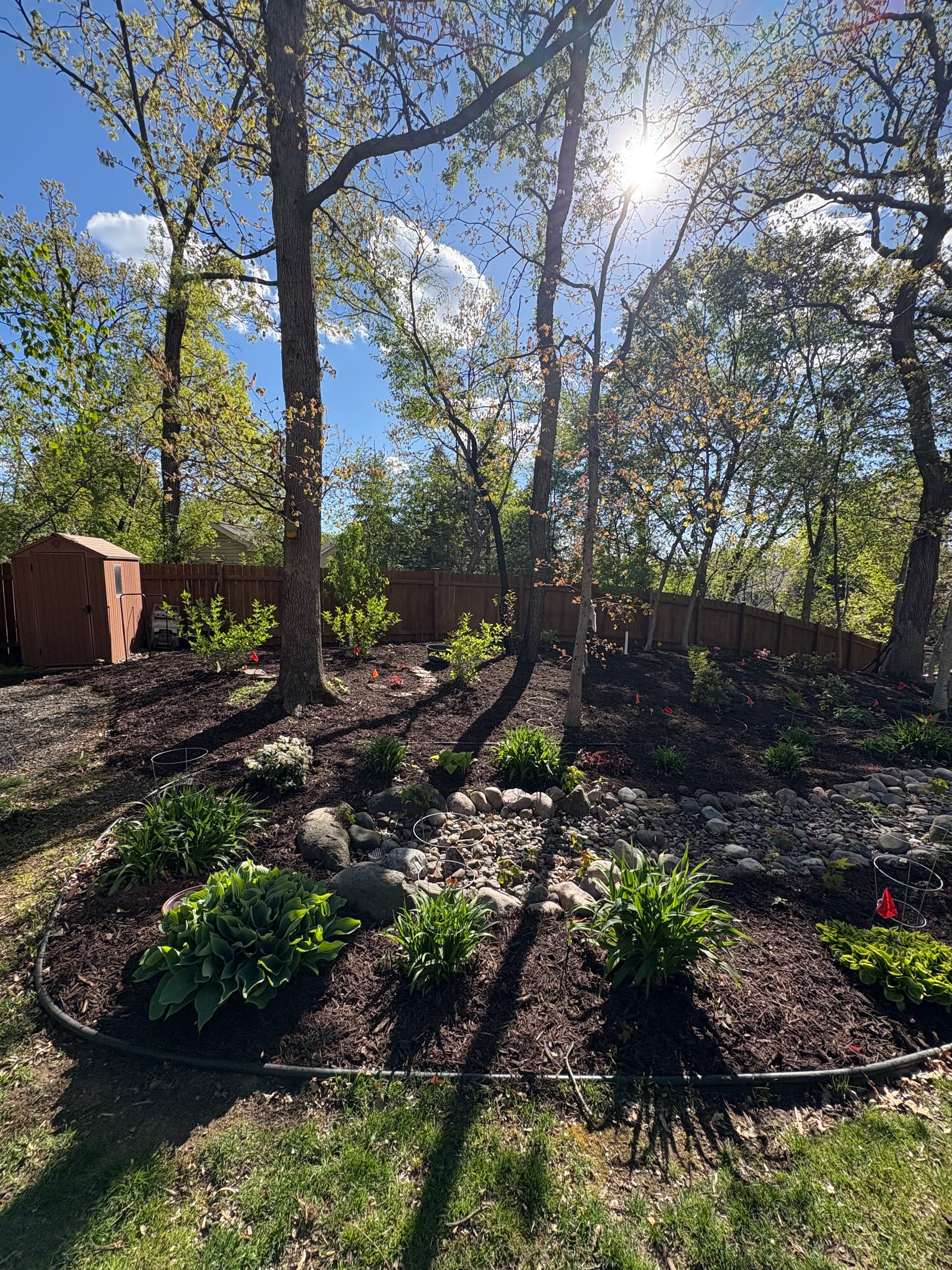 Gallery photos for Chocolate Brown Mulch and Rock Installation in Hudson: Image #4