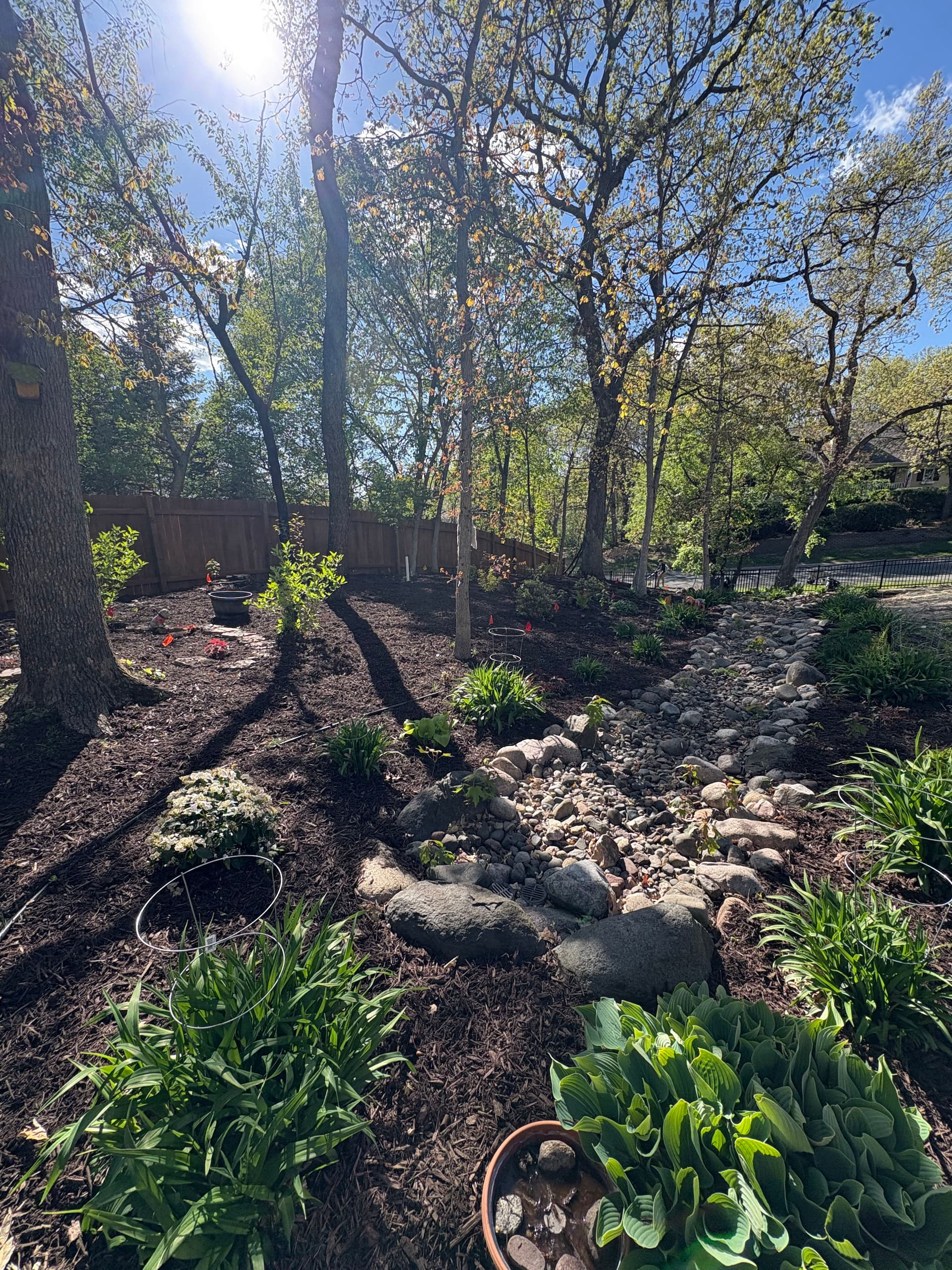 Chocolate Brown Mulch and Rock Installation in Hudson image